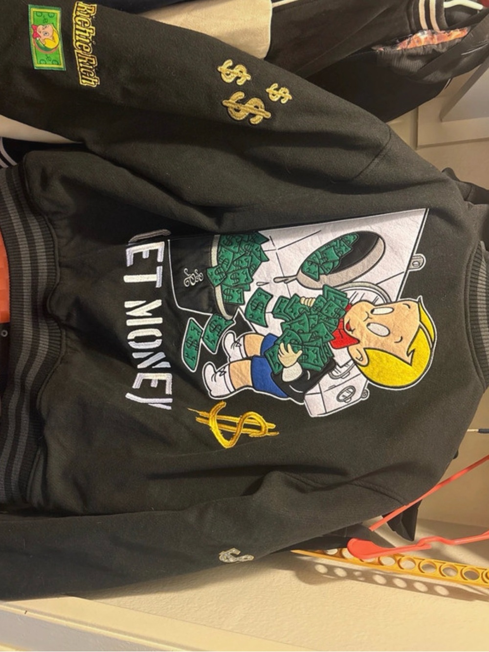 Richie Rich Black Bomber Jacket with Money Graphic